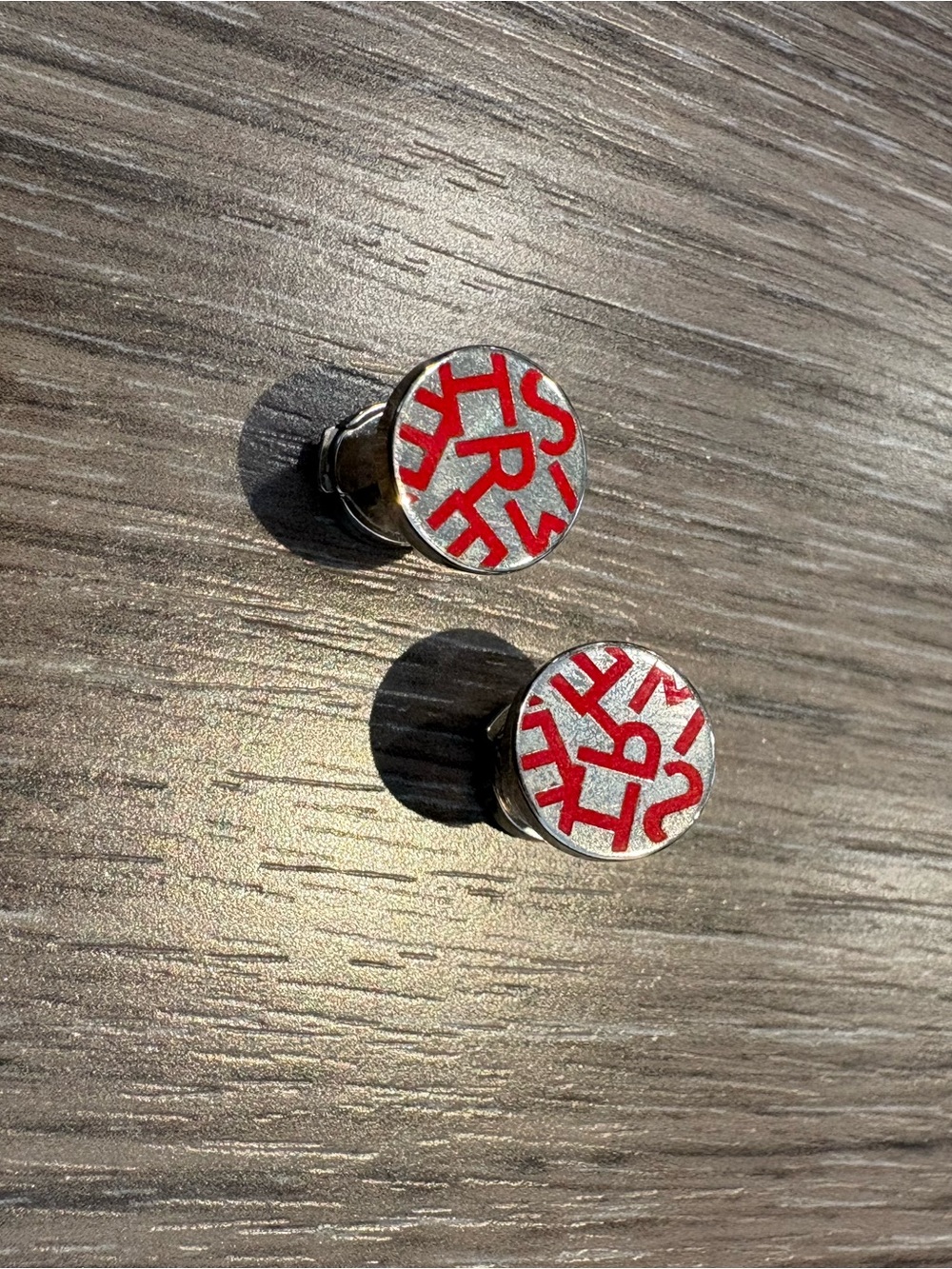 HERMES Silver and Red Round Logo Earrings